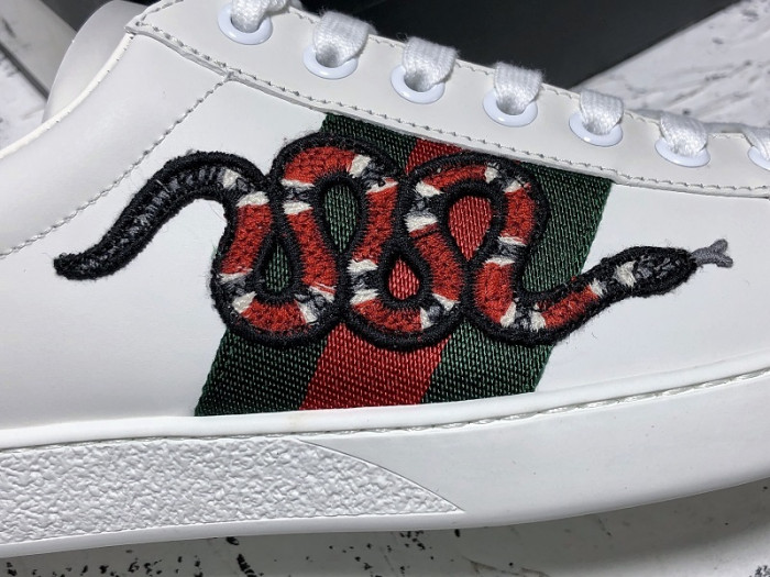 Gv*c ace embroidered low-top sneaker white with snake